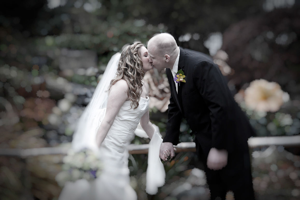 Jennie & Rob - Seattle area wedding Soft-focus photo of bride and groom kissing at Windmill Gardens