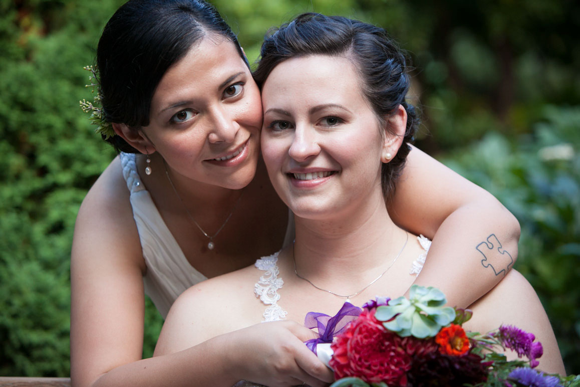 Seattle wedding photographer Tom Ellis Photography. Jessy & Kelsey - Lesbian couple, same sex wedding photo at Parsons Garden Seattle wedding photographer Tom Ellis Photography. Close up wedding photo of Jessy and Kelsey, same-sex/lesbian couple, married at the Sorrento Hotel